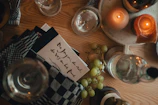 a table with wine glasses and candles