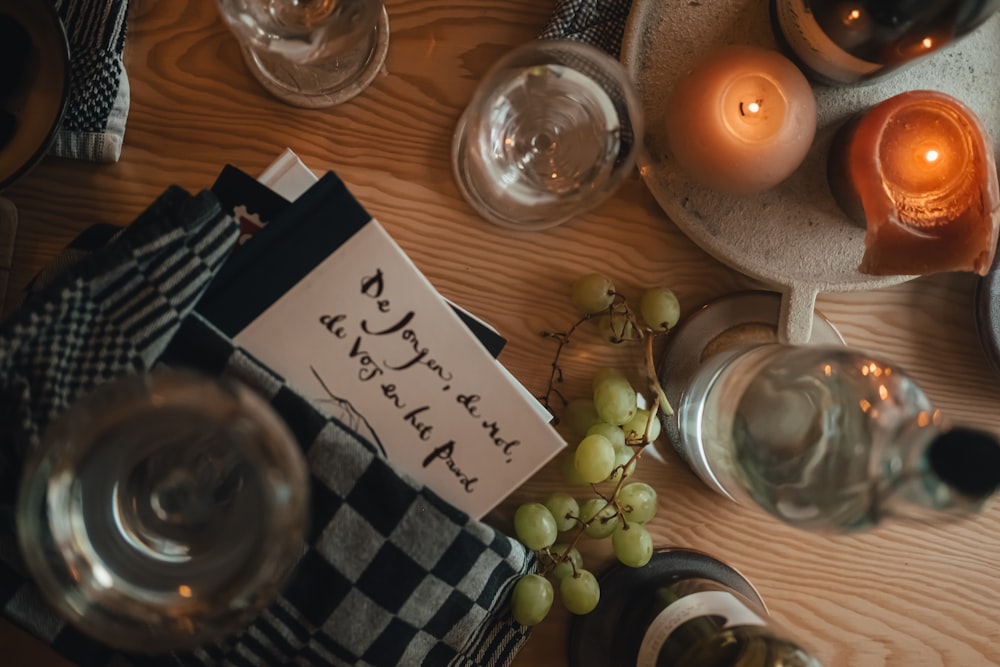 a table with wine glasses and candles