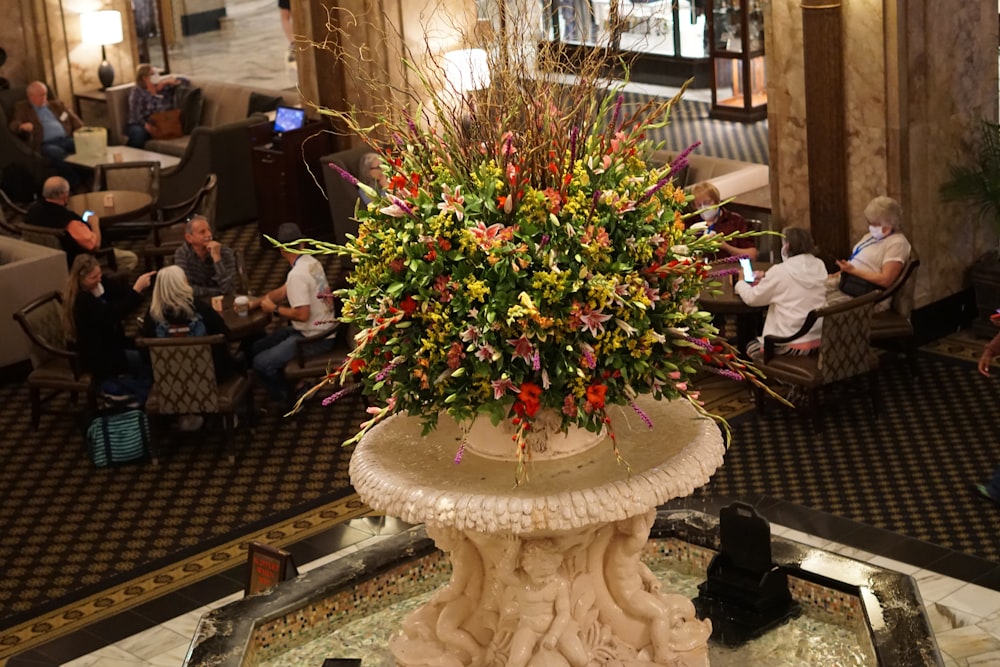 a large vase with flowers