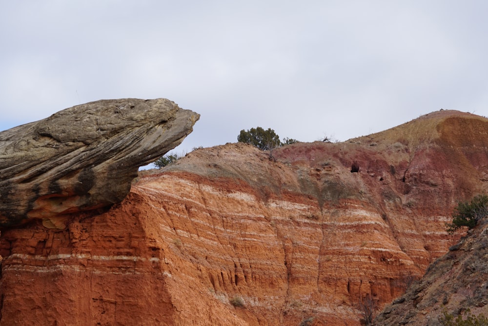 a large red rock cliff