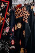 a group of black and red dresses
