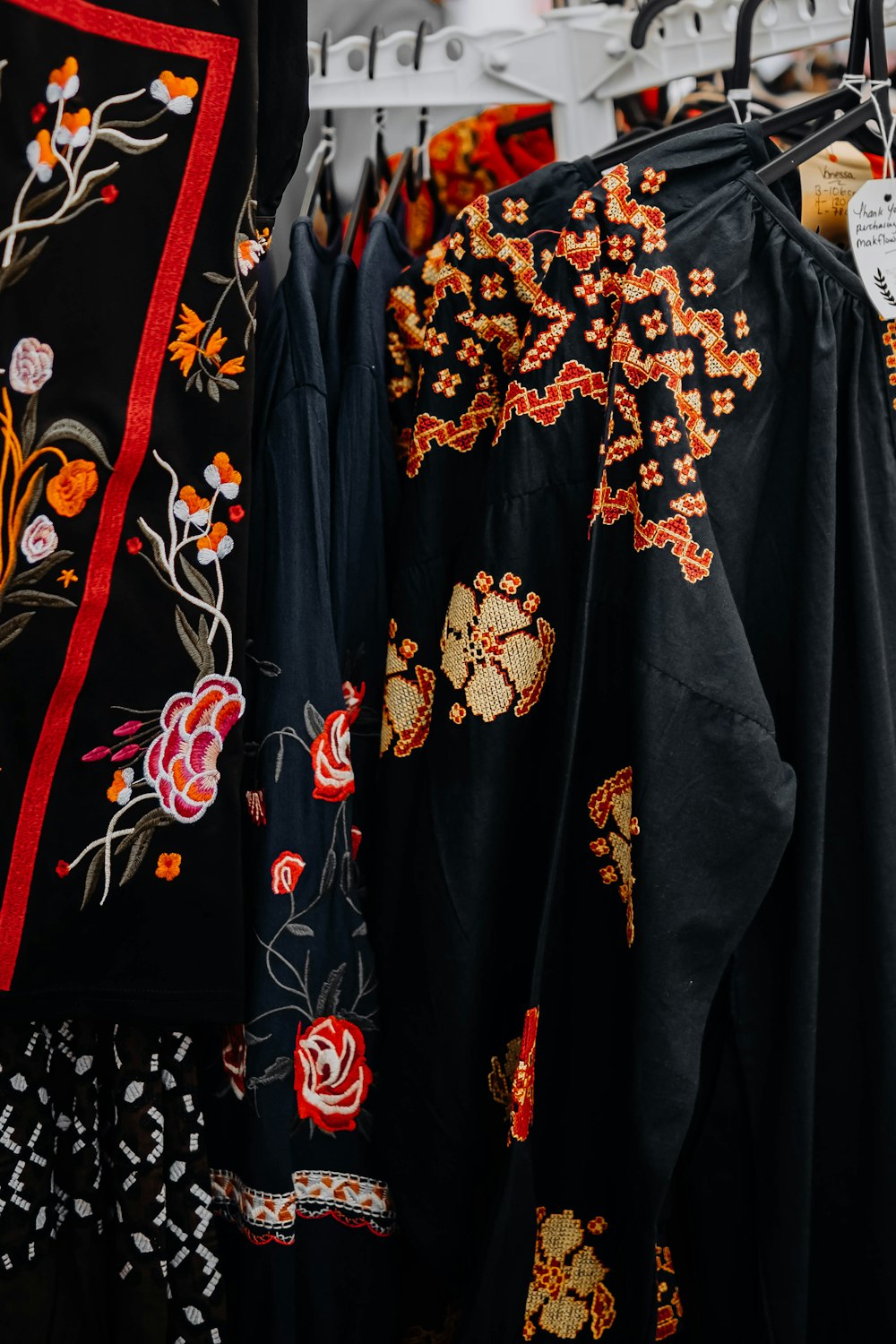 a group of black and red dresses