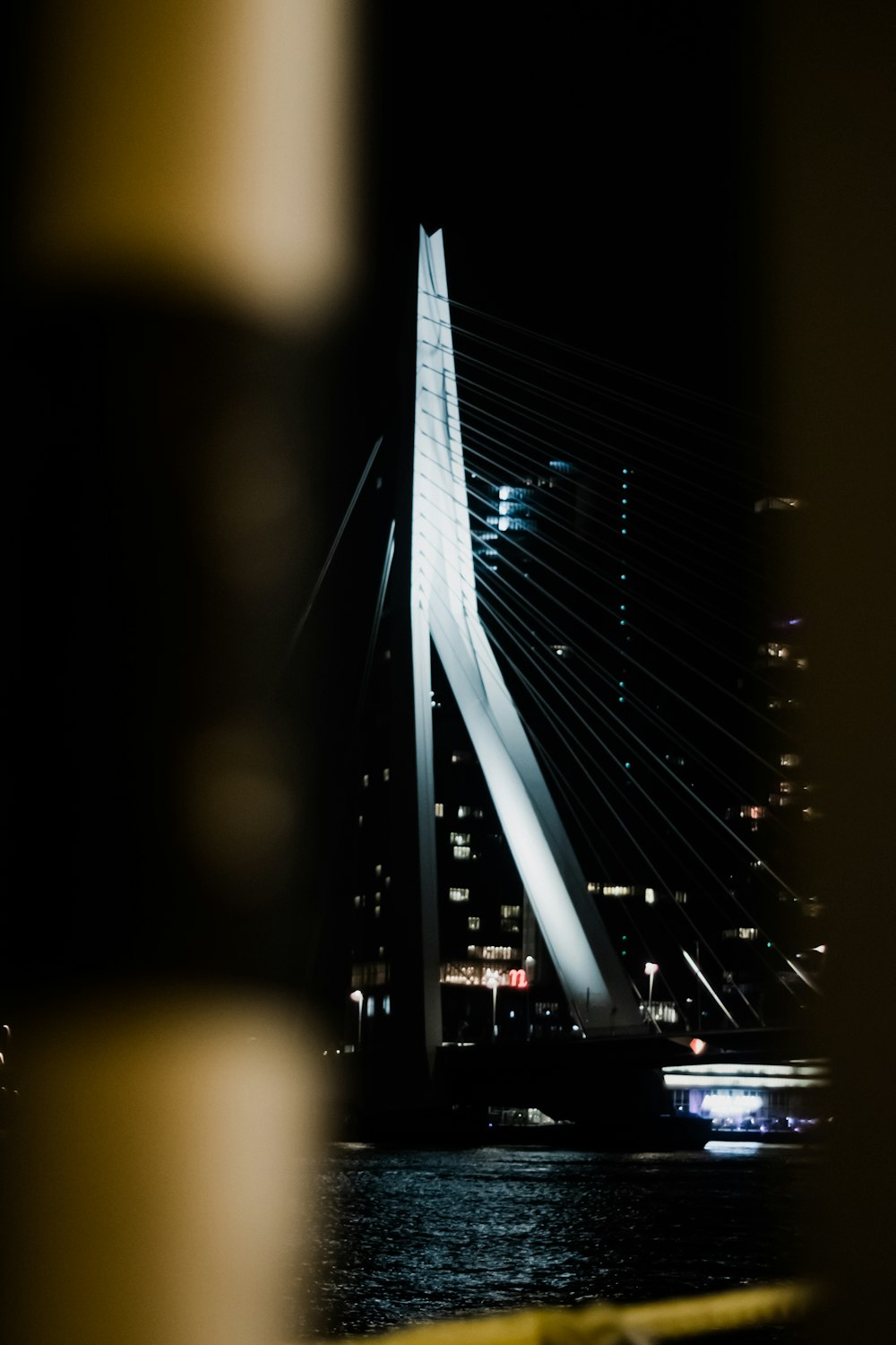 a large bridge with lights at night