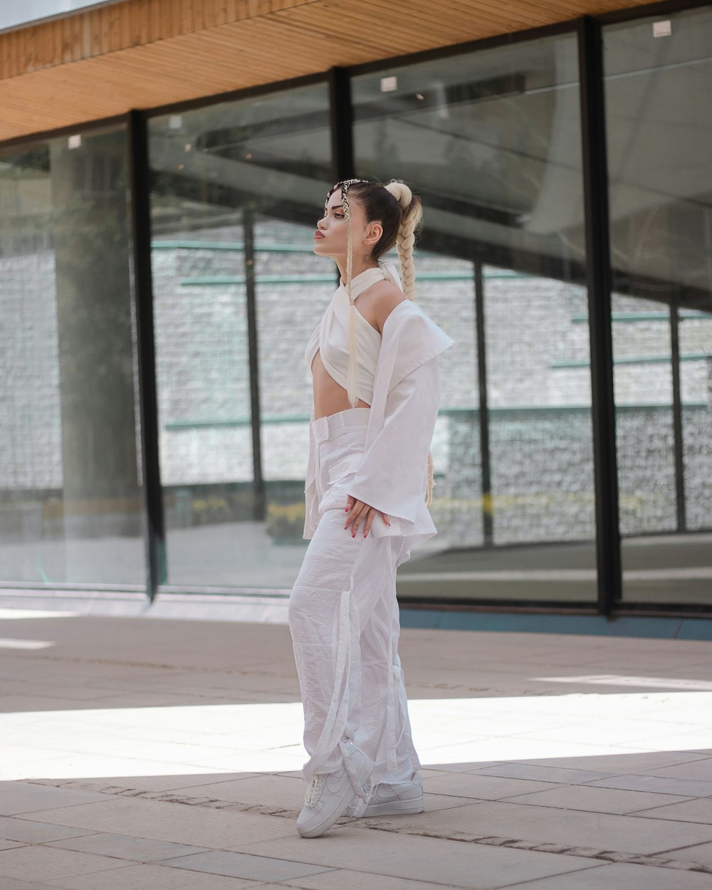 a woman in a white suit