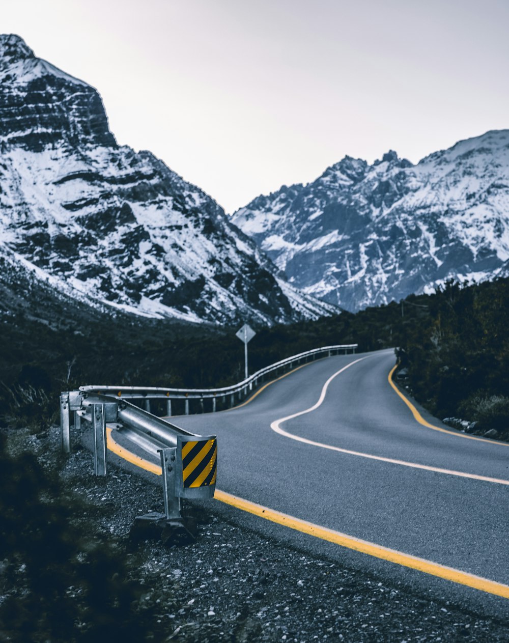 a road with snow on the side