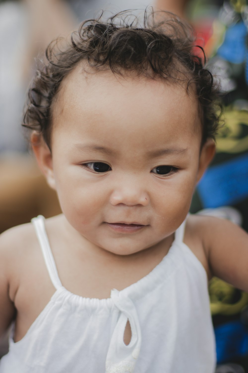 a baby with a ponytail