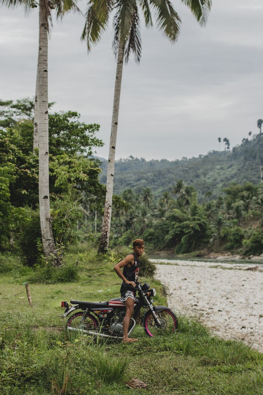 a person standing next to a bicycle