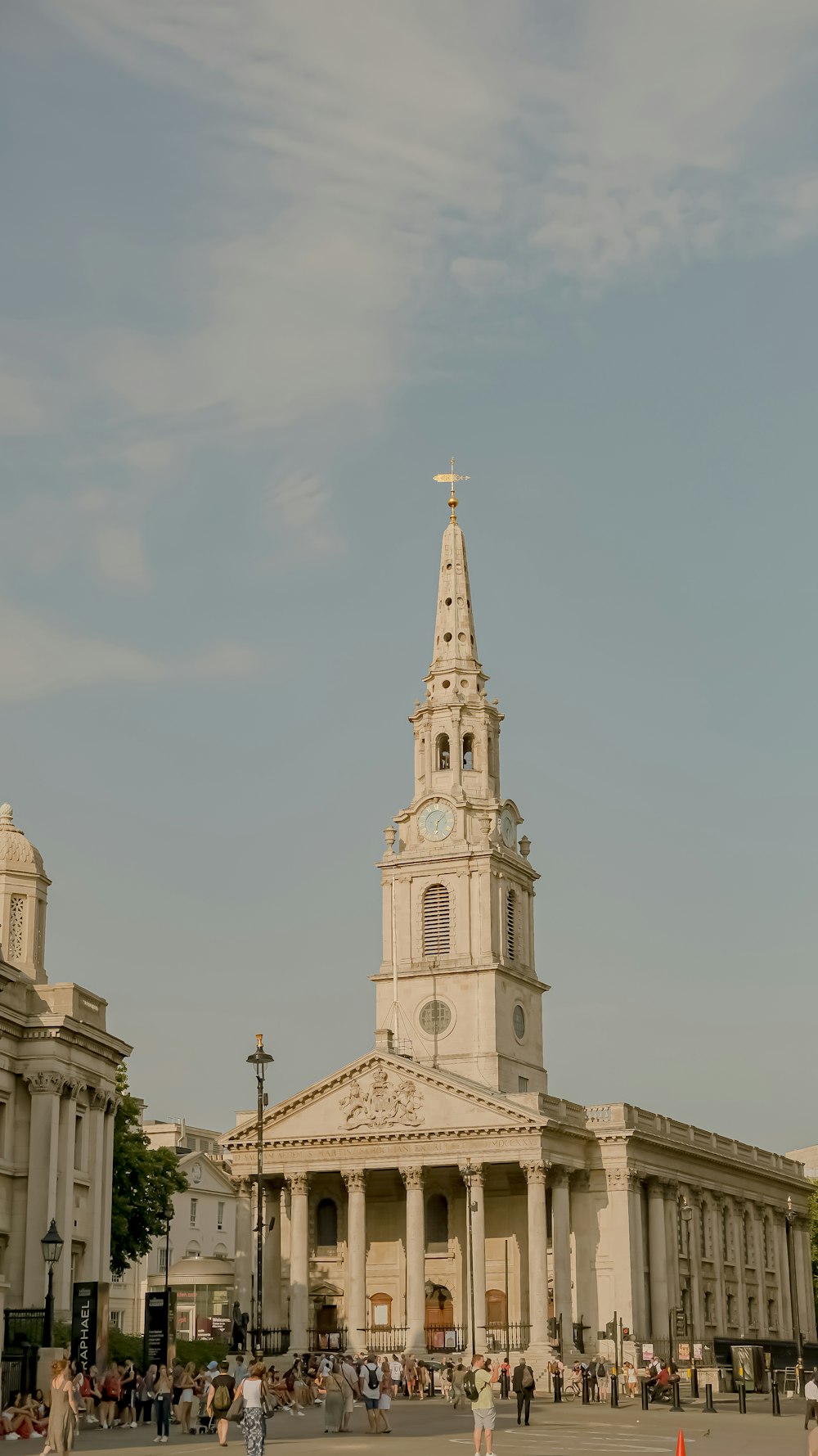 a large white building with a clock tower