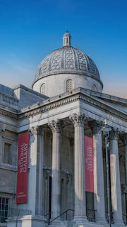 a building with a dome and pillars