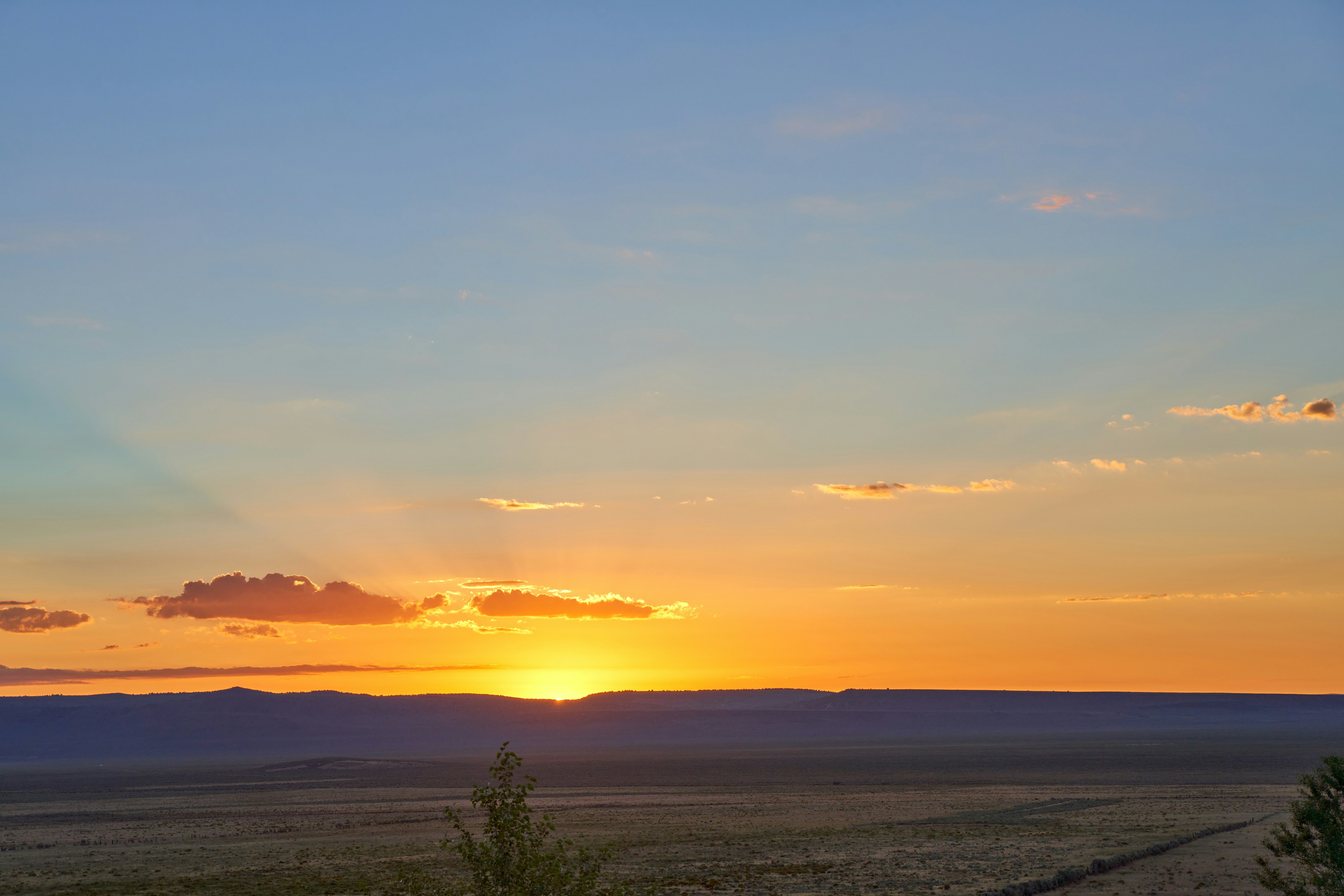 a sunset over a large body of water
