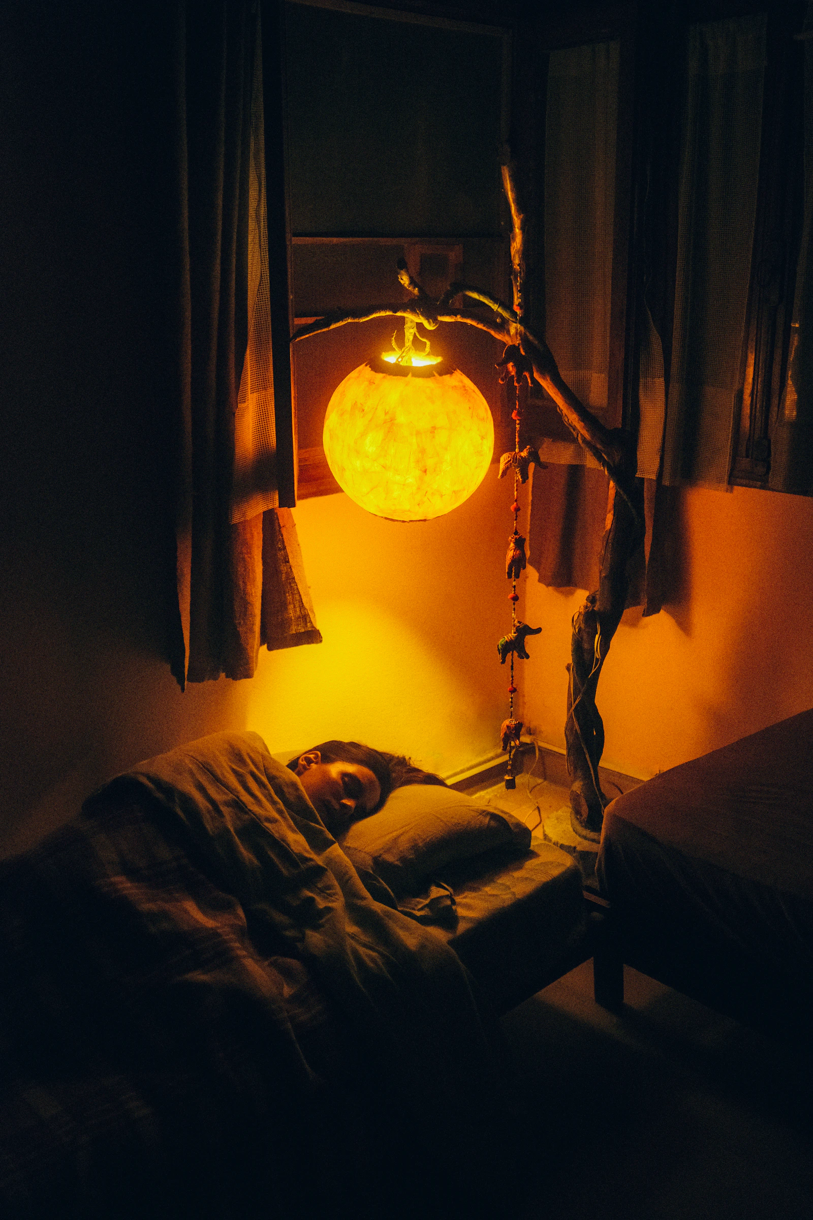 A person sleeping peacefully in a softly lit bedroom