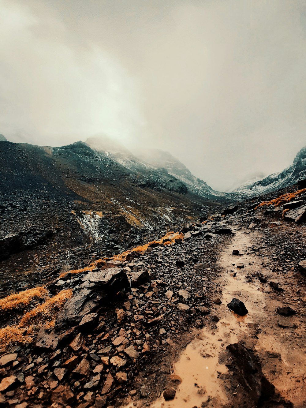 a rocky and snowy mountain