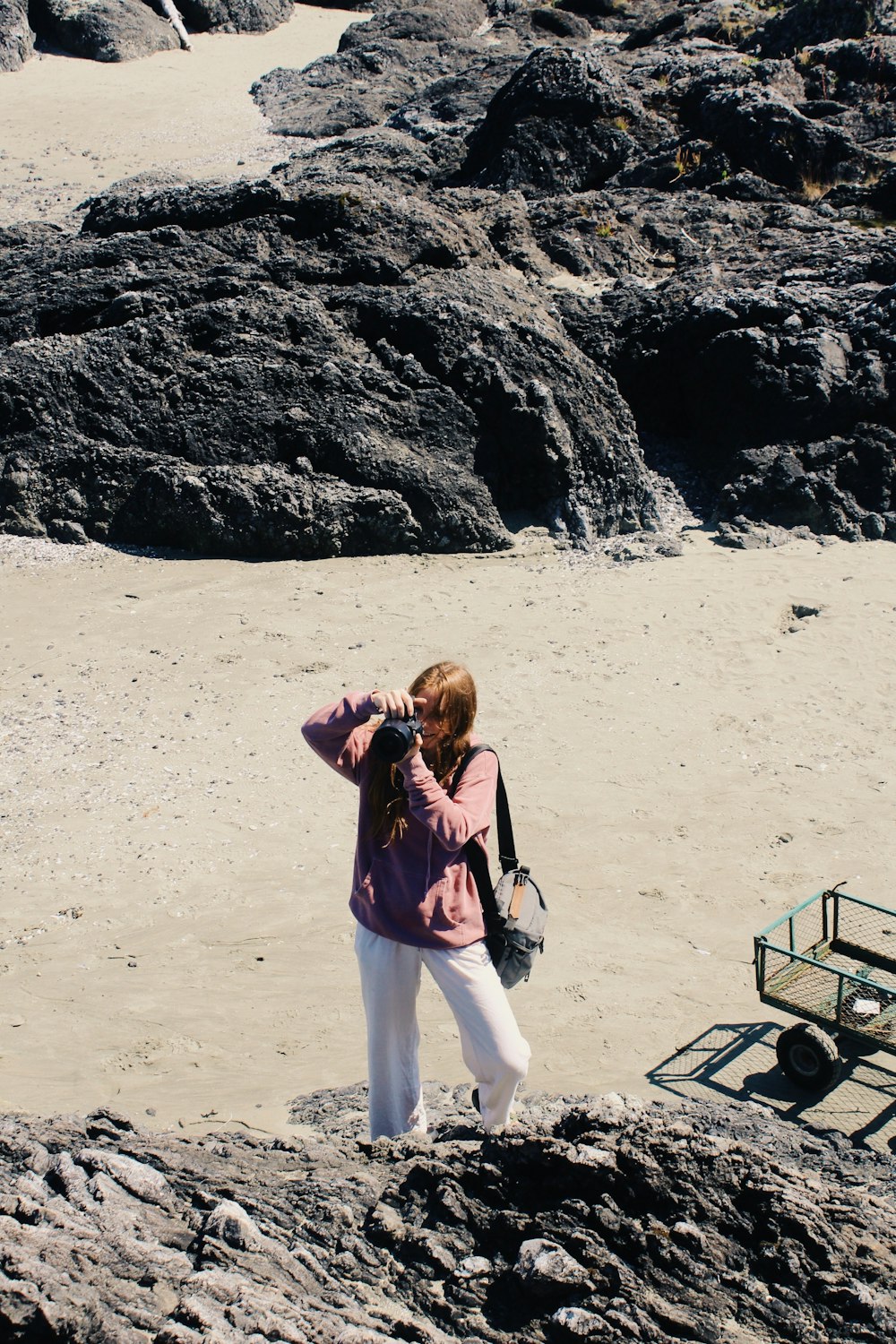 a person taking a picture of herself on a beach