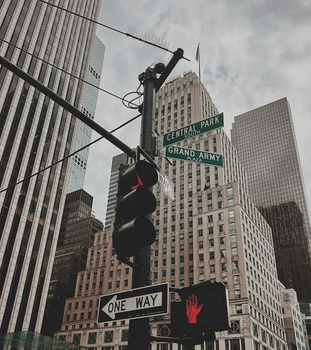 a street sign next to a traffic light