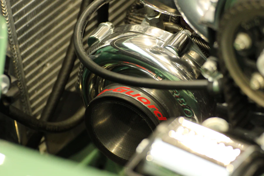 Turbocharged engine bay in a dark workshop