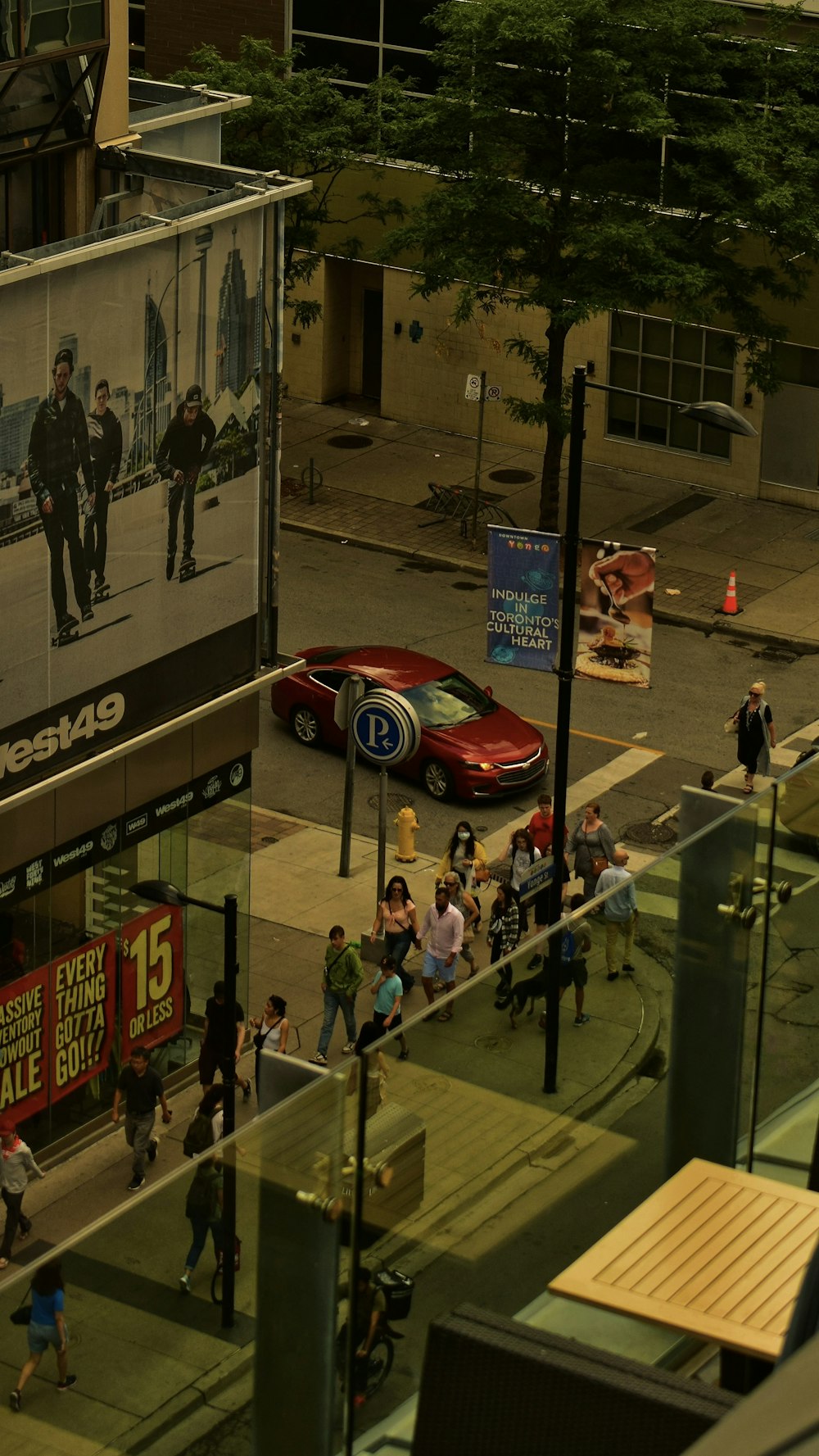 a group of people walking on a sidewalk