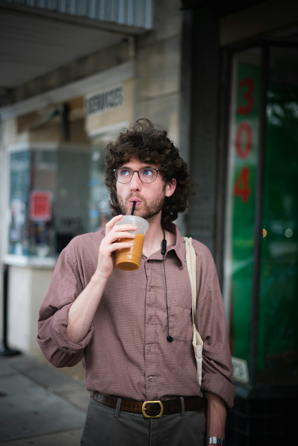 a man drinking a beer