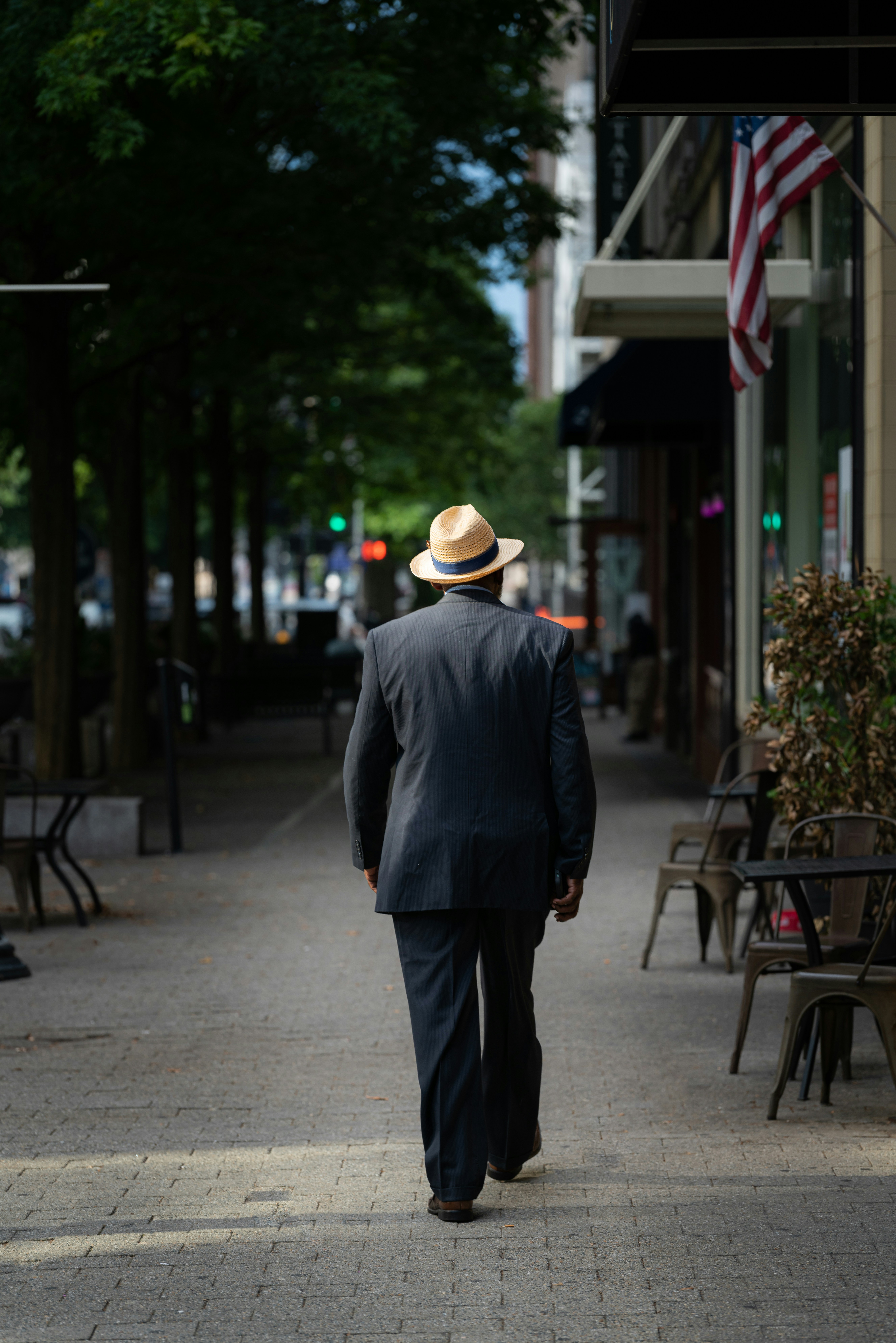 a man walking down a sidewalk