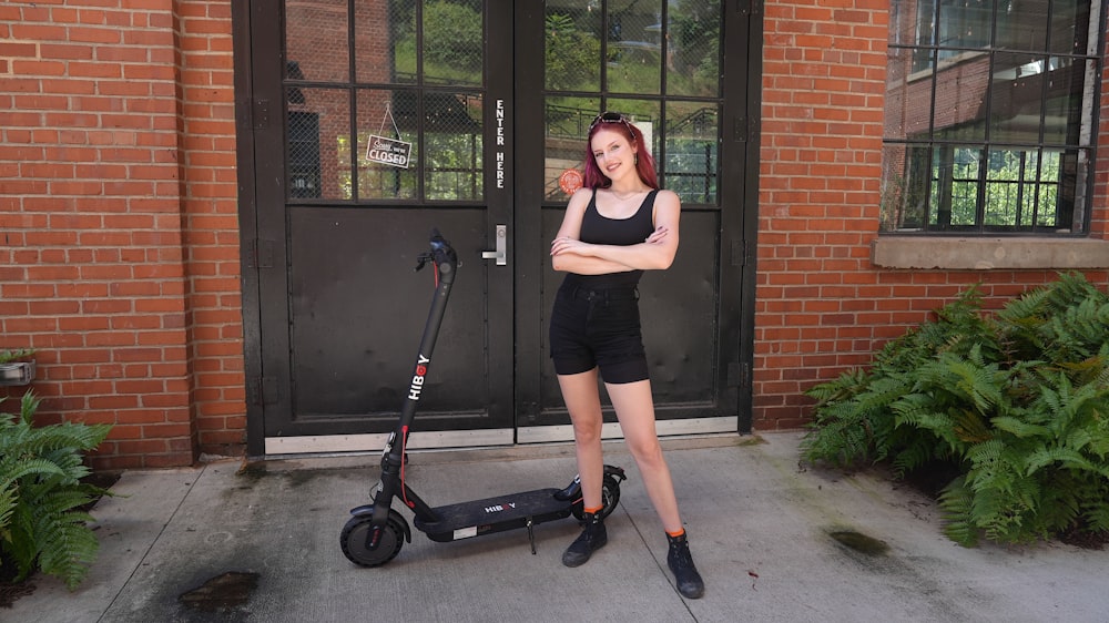 a person standing next to a lawn mower