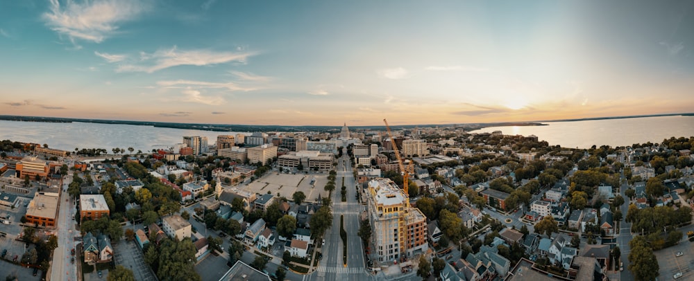 a city with a body of water in the background