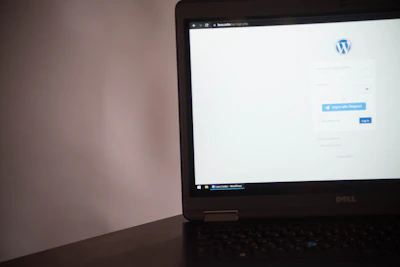 A sleek laptop screen showing the email setup page for the páginaclave domain.