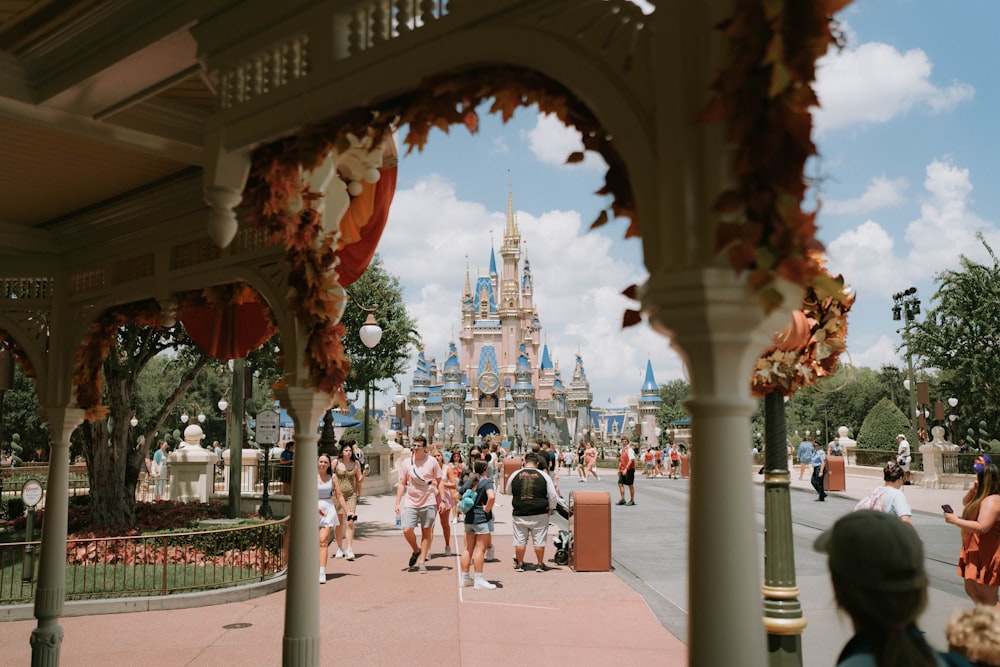 a large arch with people walking around