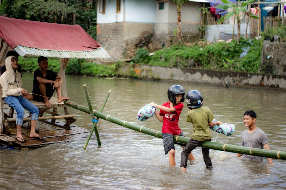 a group of people in a flooded area