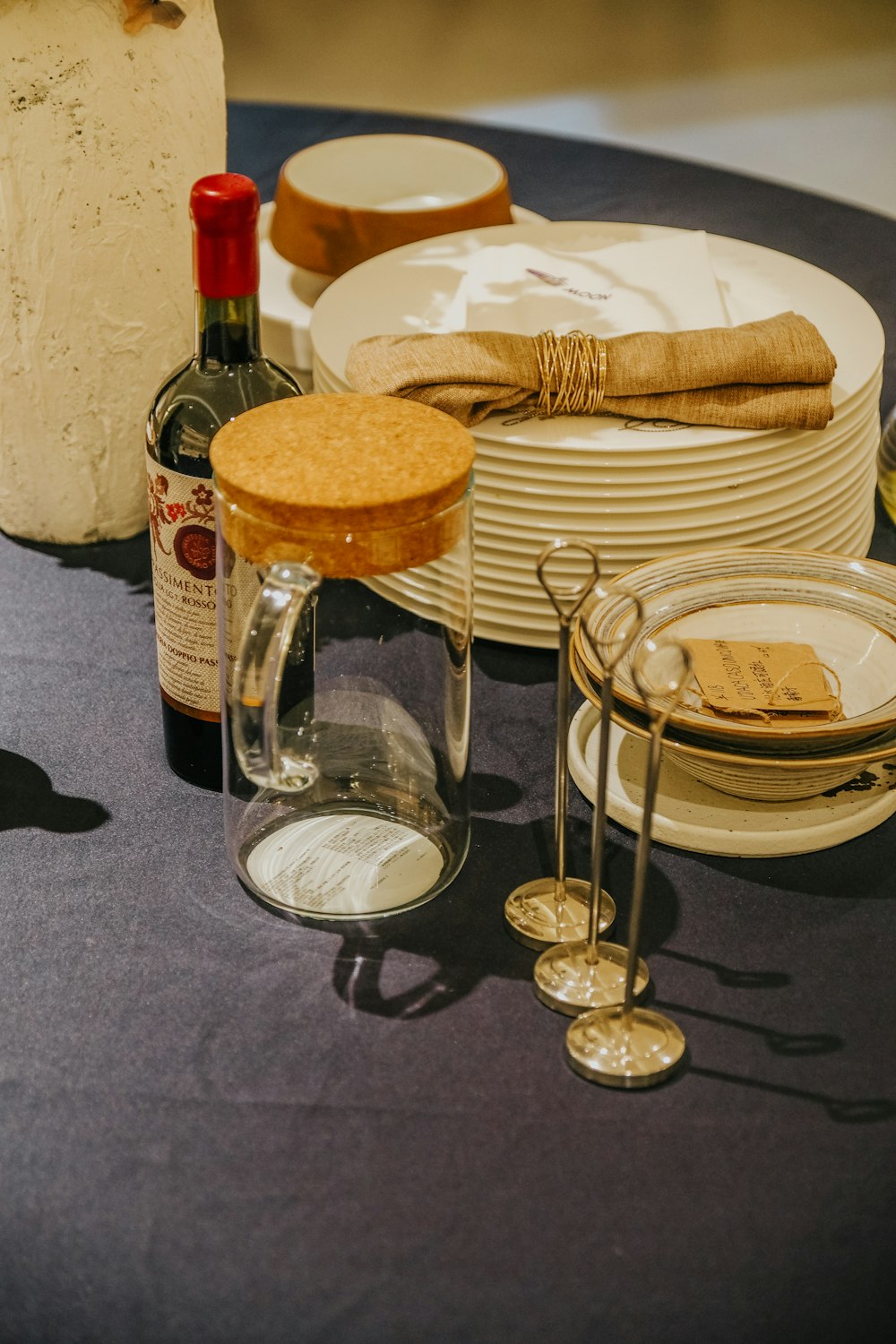 a group of plates and glasses with food on them