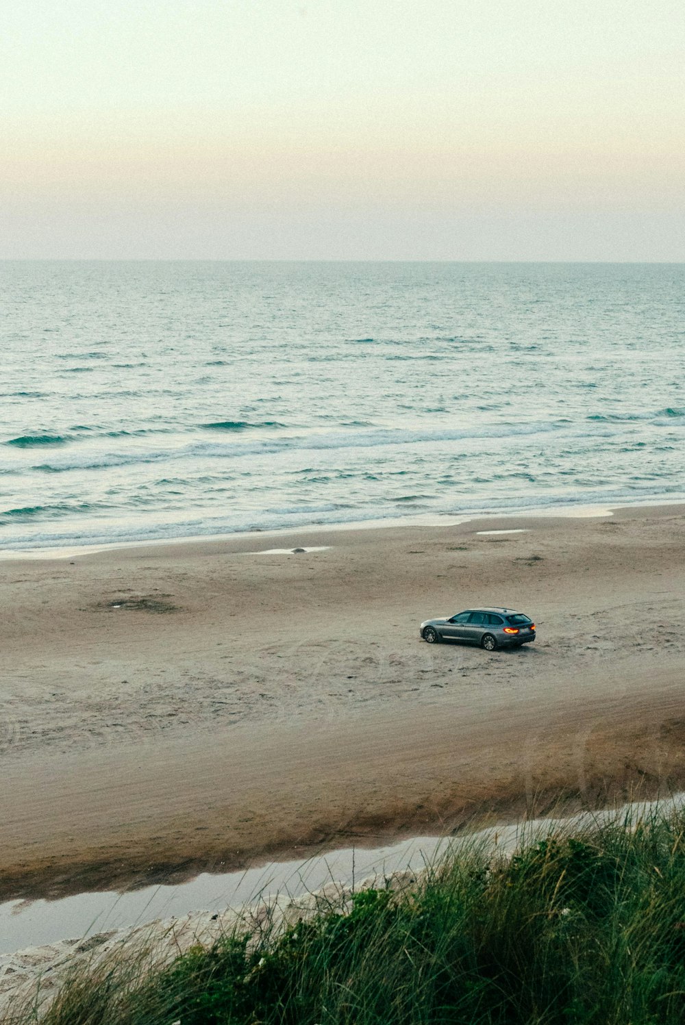 a car driving on a beach