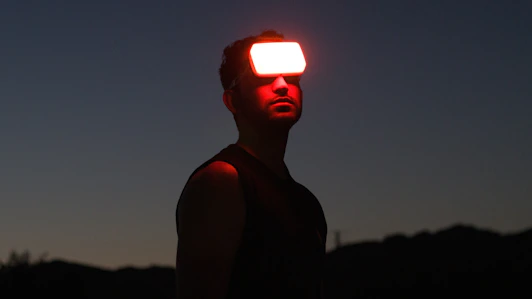 a man with a bright light behind him