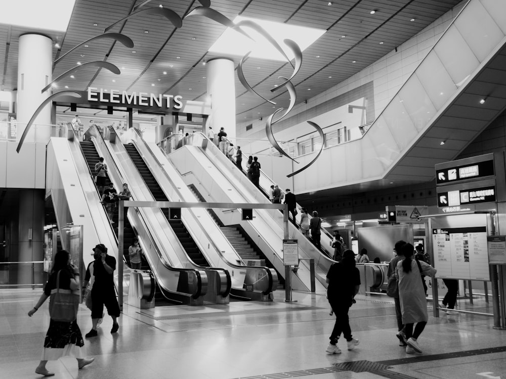 people walking in a train station