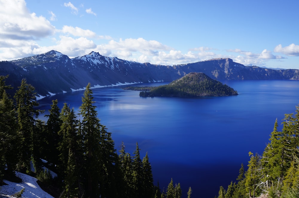 Crater Lake National Park surrounded by trees and mountains