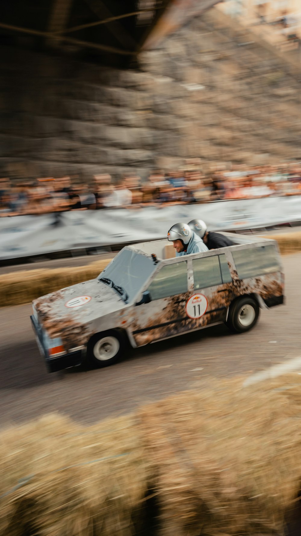 a couple of people in a race car