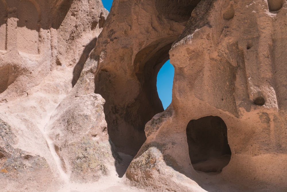 a rock formation with a hole in it