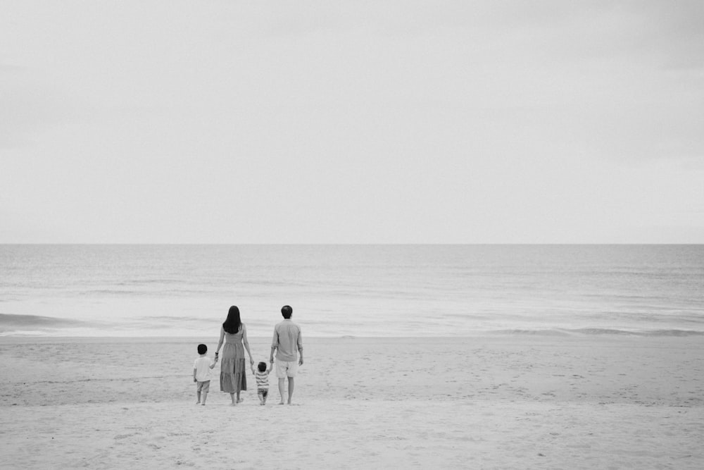 a family walking on the beach