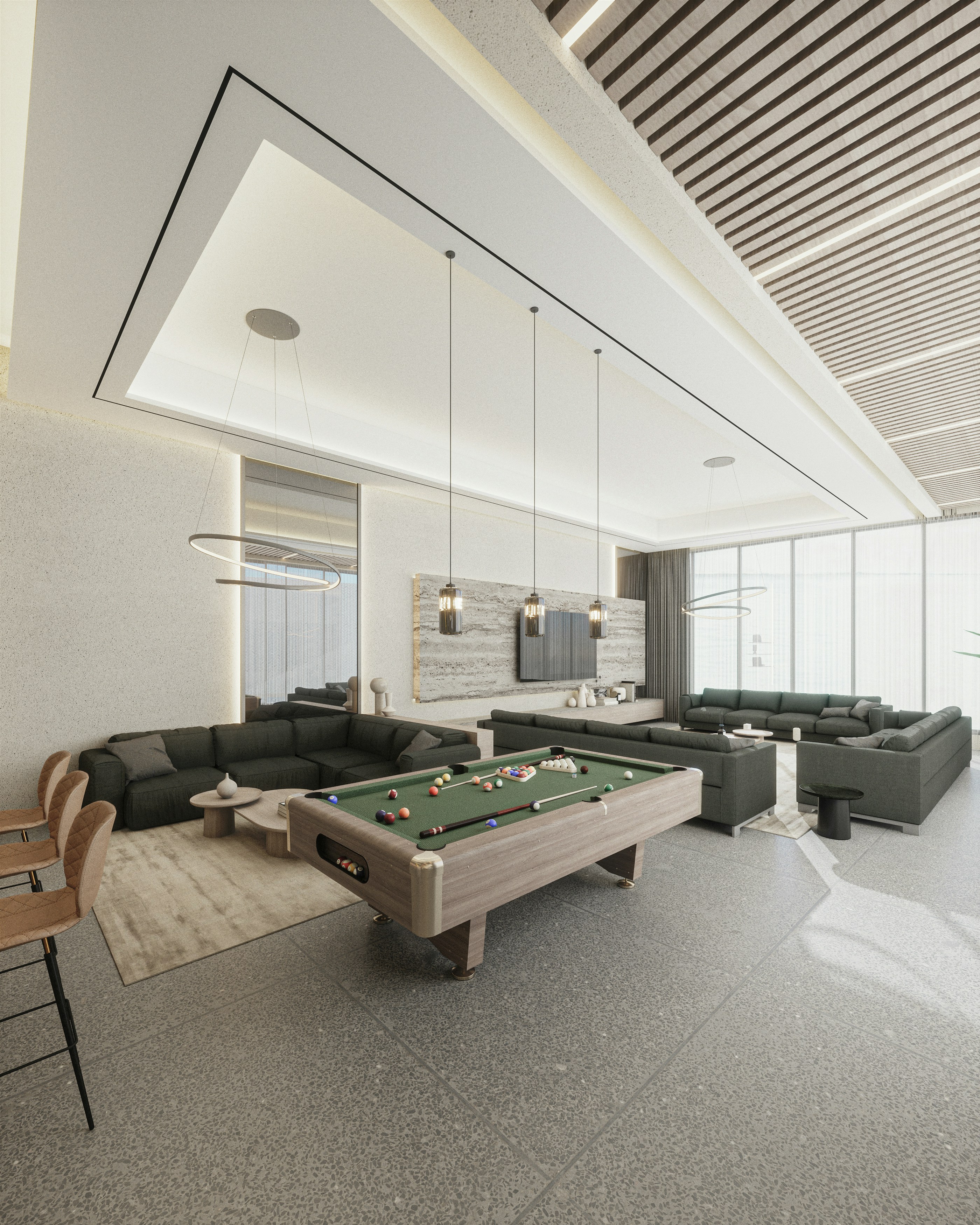 a room with a pool table and couches