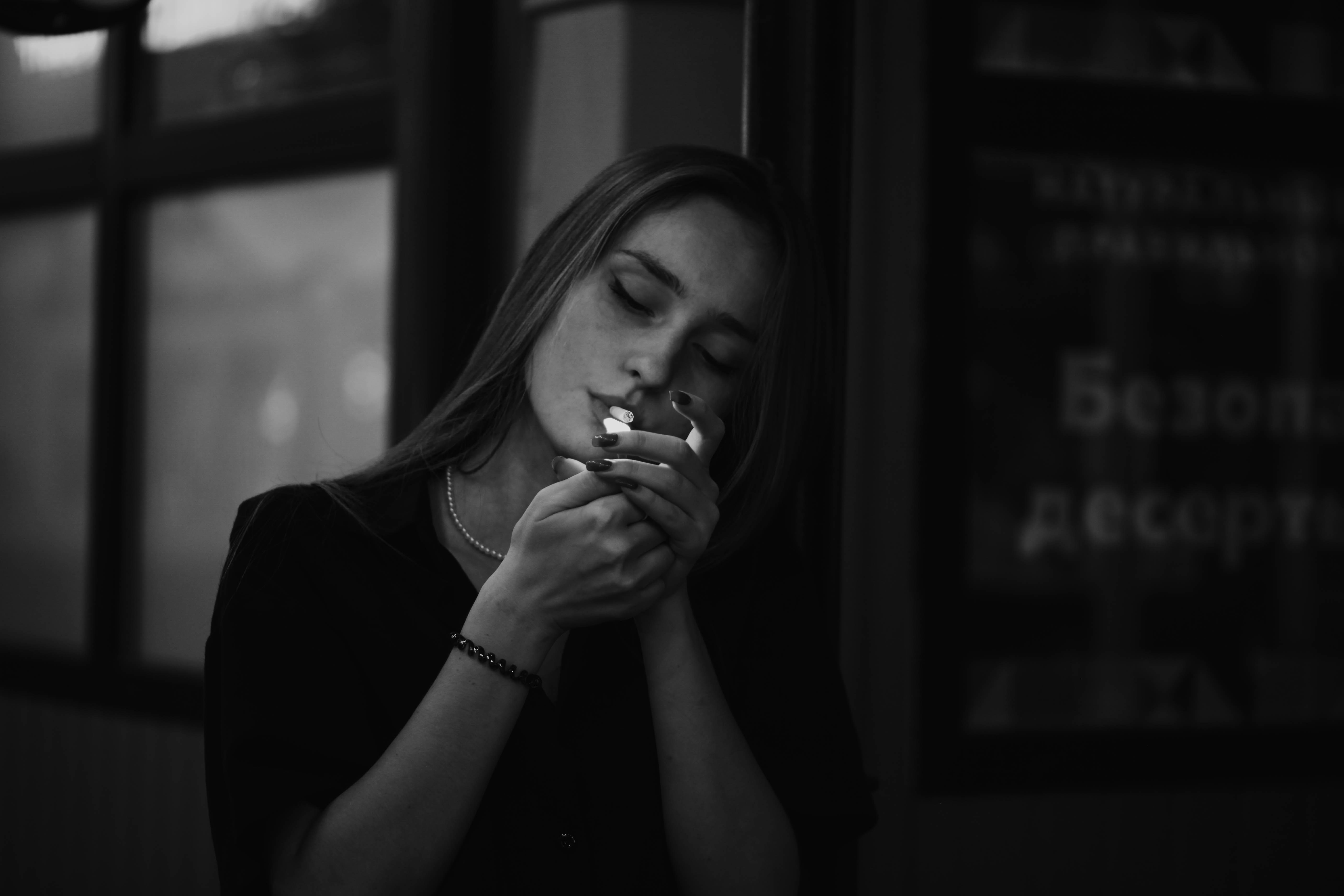 a woman smoking a cigarette