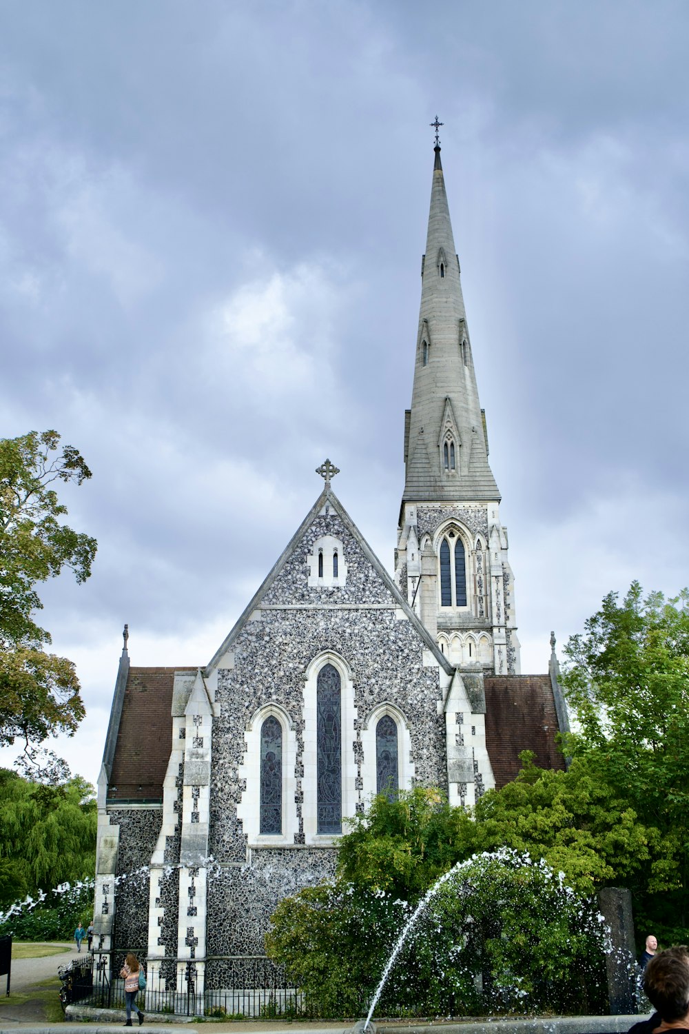 a church with a fountain in front