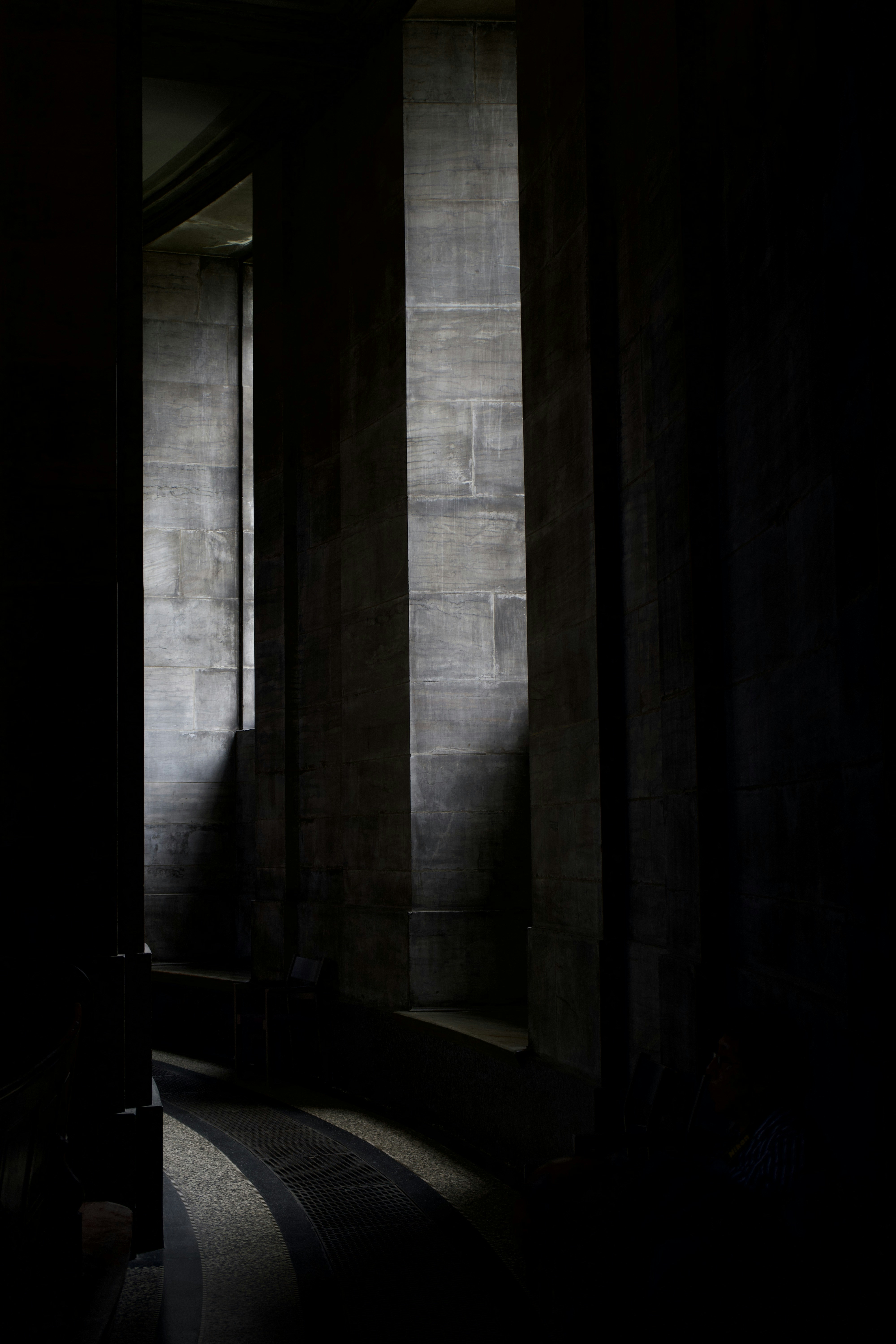 a dark room with a bed