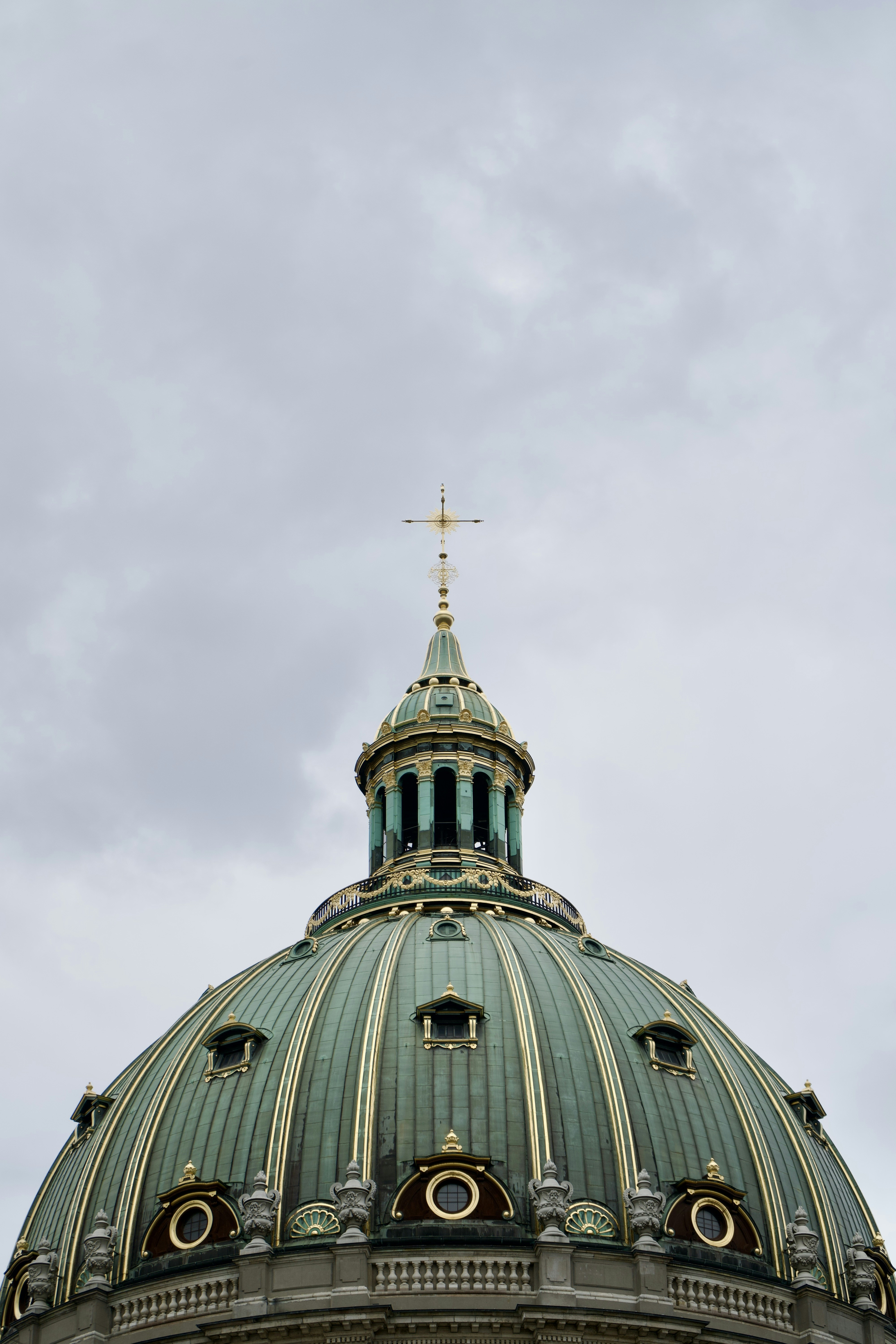 a domed building with a cross on top