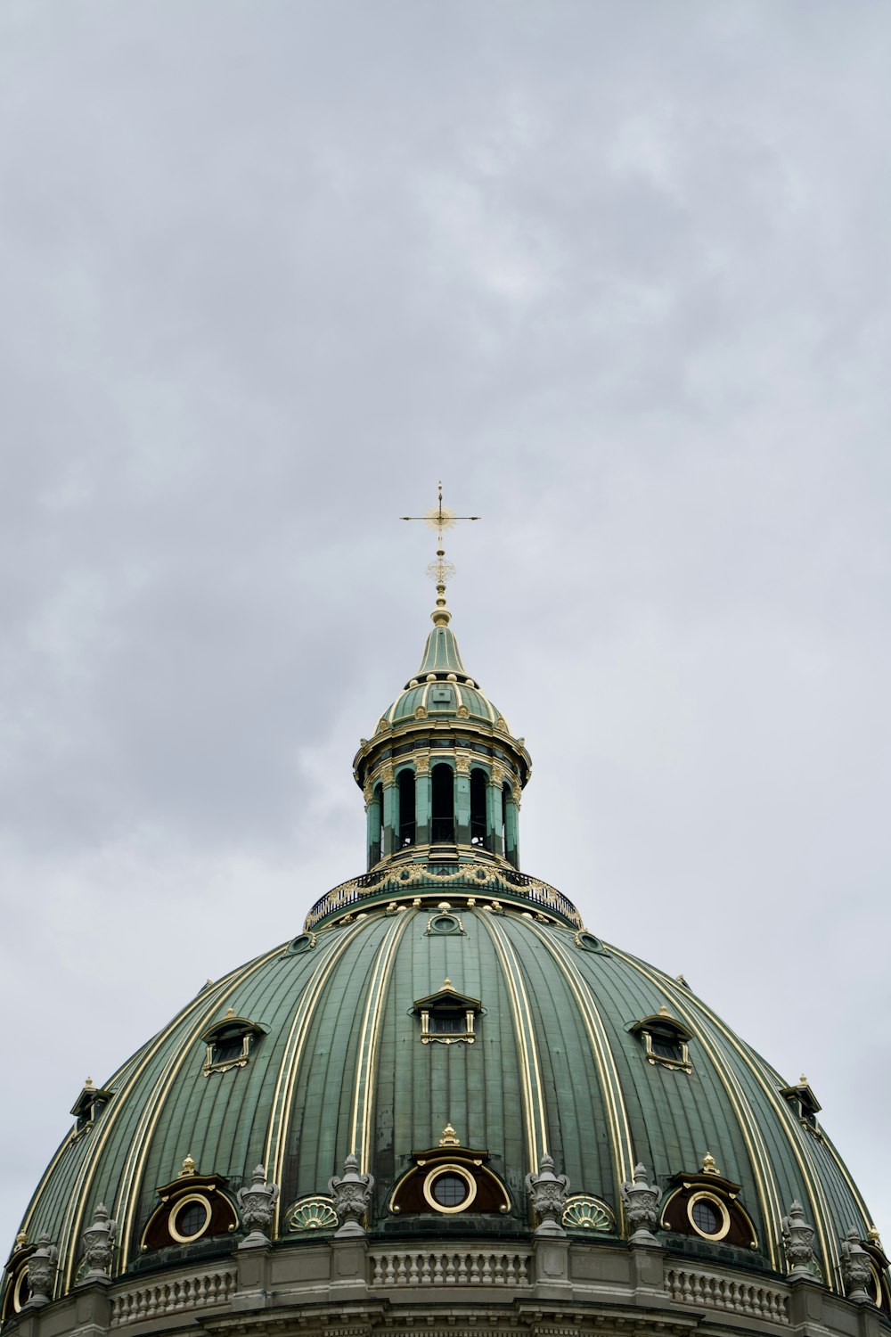 a domed building with a cross on top