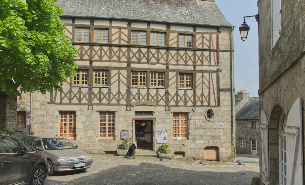 a building with a person sitting in front of it