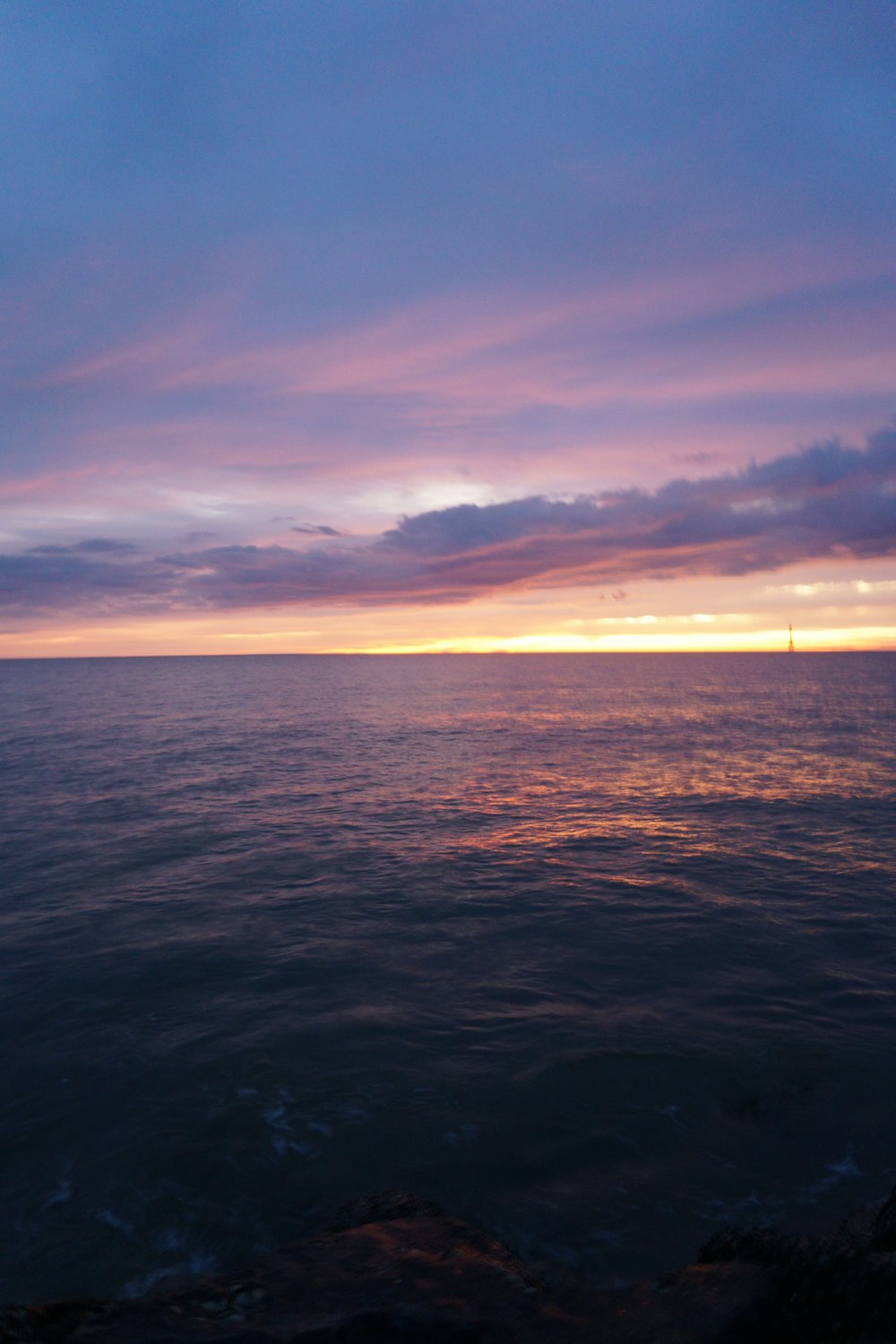 a body of water with a sunset