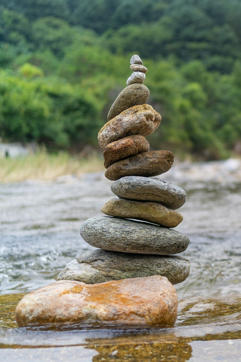 a stack of rocks in a river