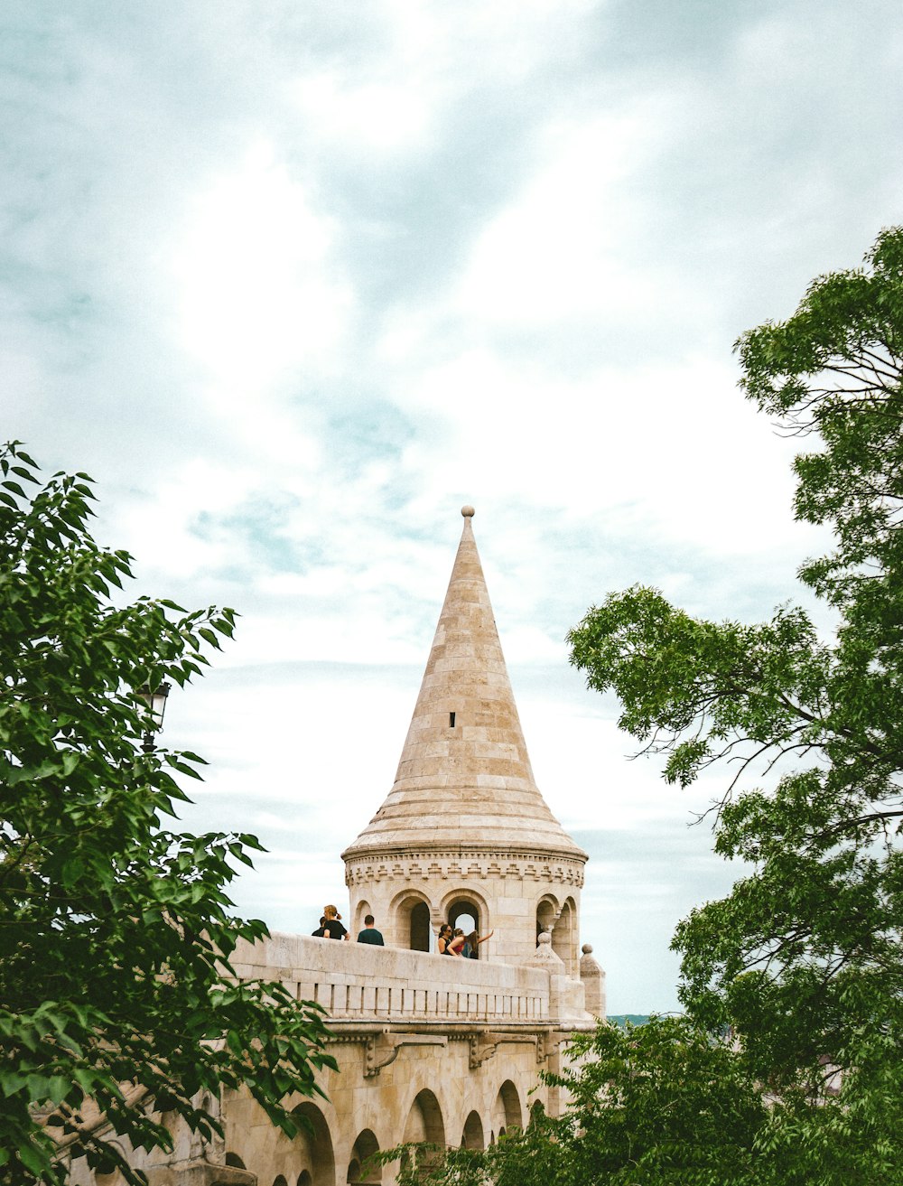 a tall building with a pointed roof