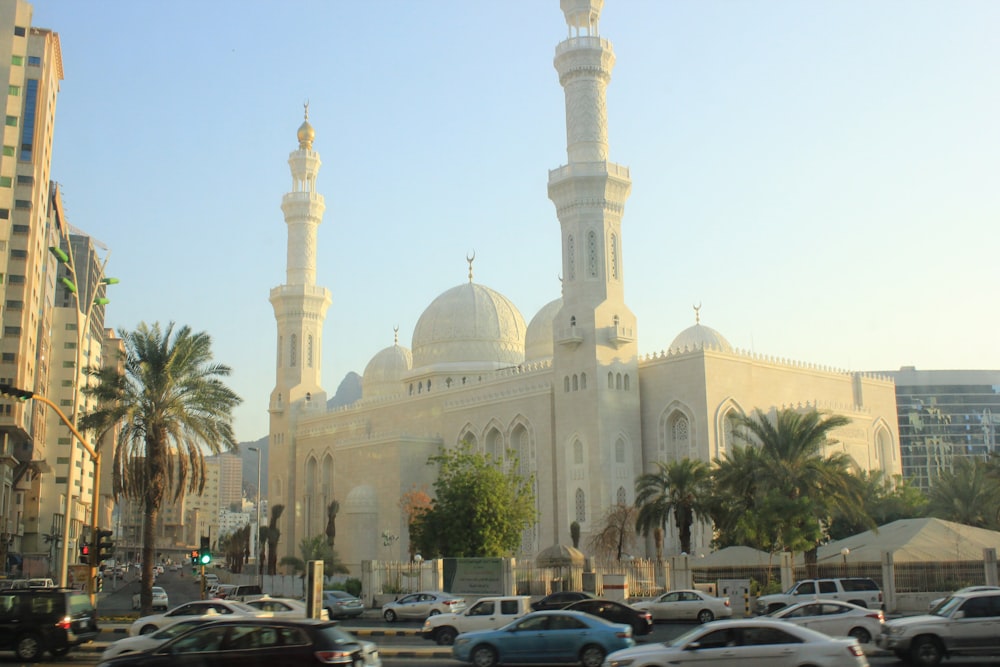 a large building with towers and domes with Jumeirah Mosque in the background