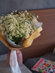 a vase with yellow flowers
