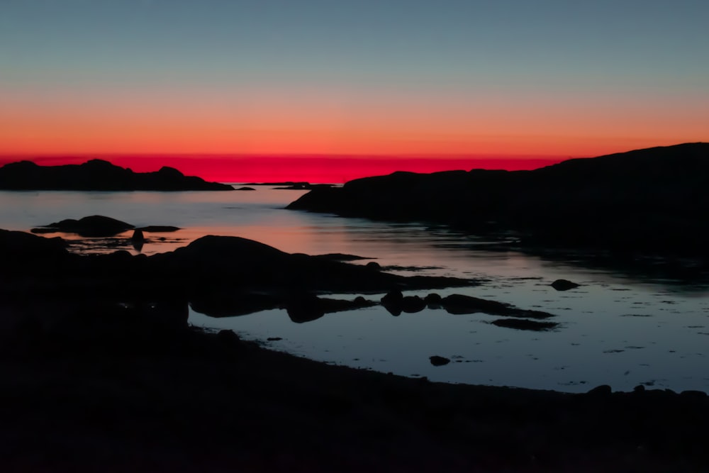 a sunset over a body of water