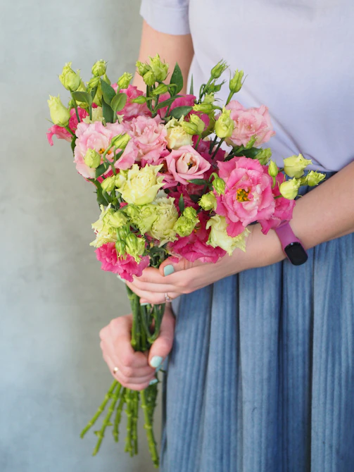 a person holding a bouquet of flowers