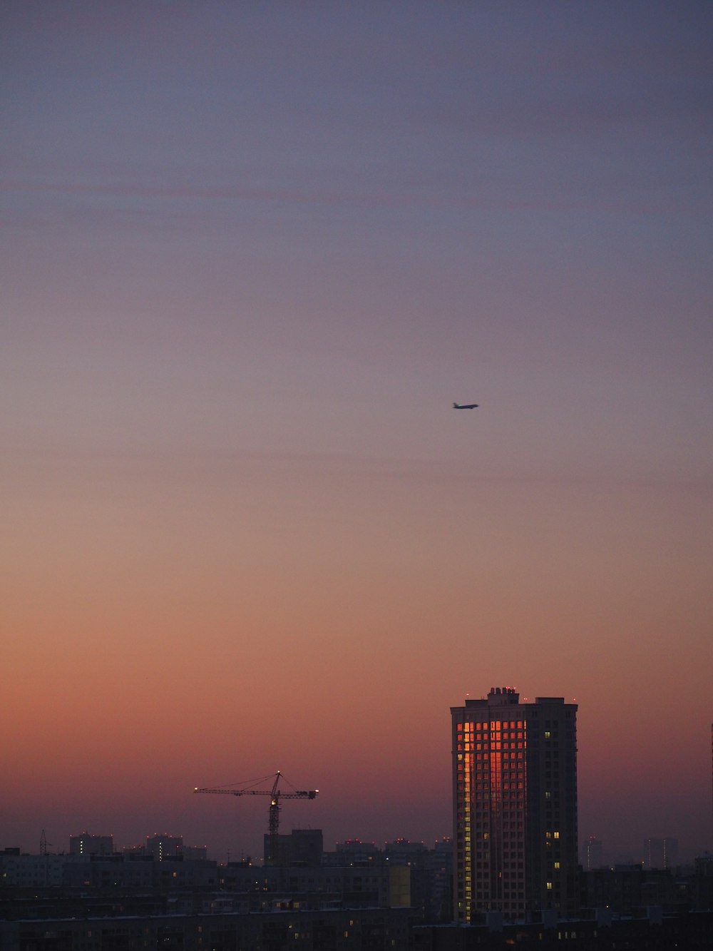 a plane flying over a city